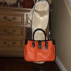 Dooney Ostrich stamped leather shoulder bag.